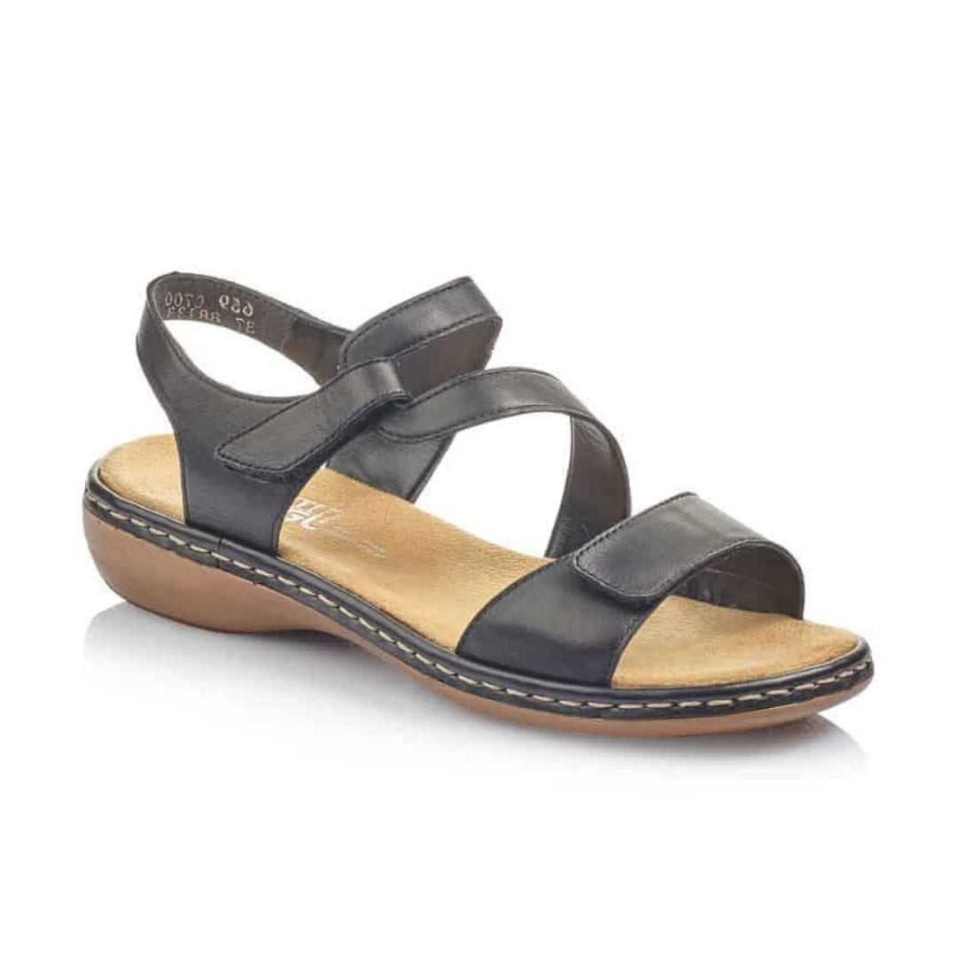 Black Rieker 659C7 women's leather sandal with Velcro straps, cushioned insole and flexible outsole for everyday wear.