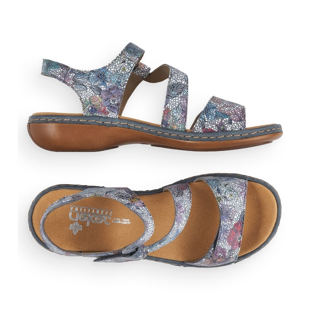 Blue multi sandal with Velcro toe strap and Velcro loop ankle strap with slight block heel and tan footbed