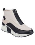 A White Rieker top zipper sneaker with black accents and black and white wedge outsole.