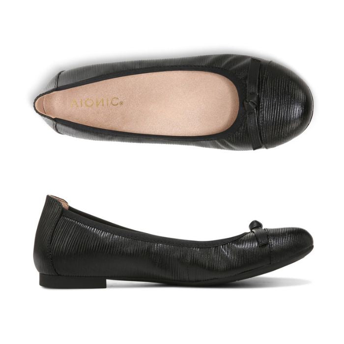 Black leather ballerina flat with bow on toe.