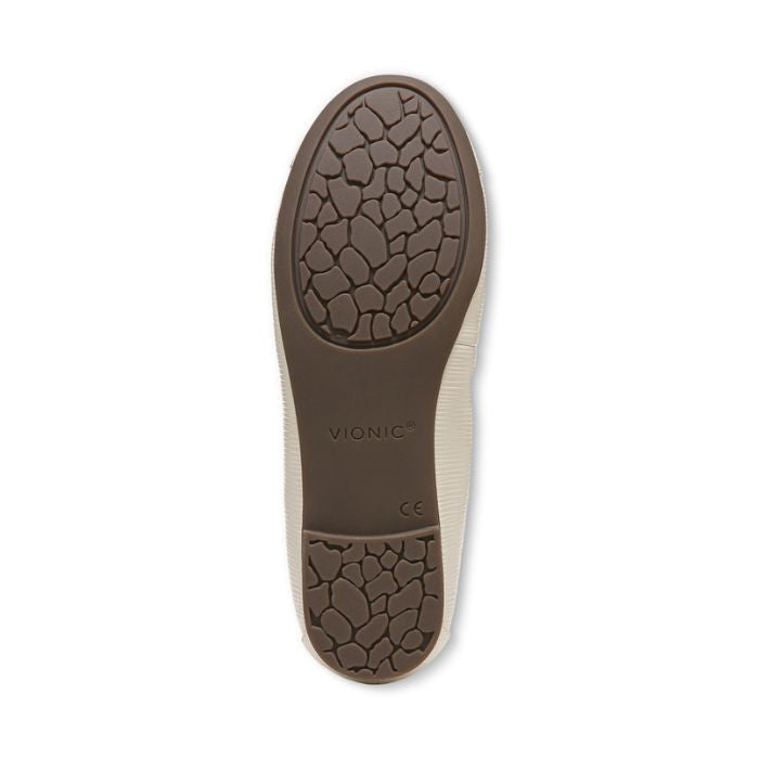 Brown rubber outsole of women&#39;s ballerina flat with Vionic logo on center.