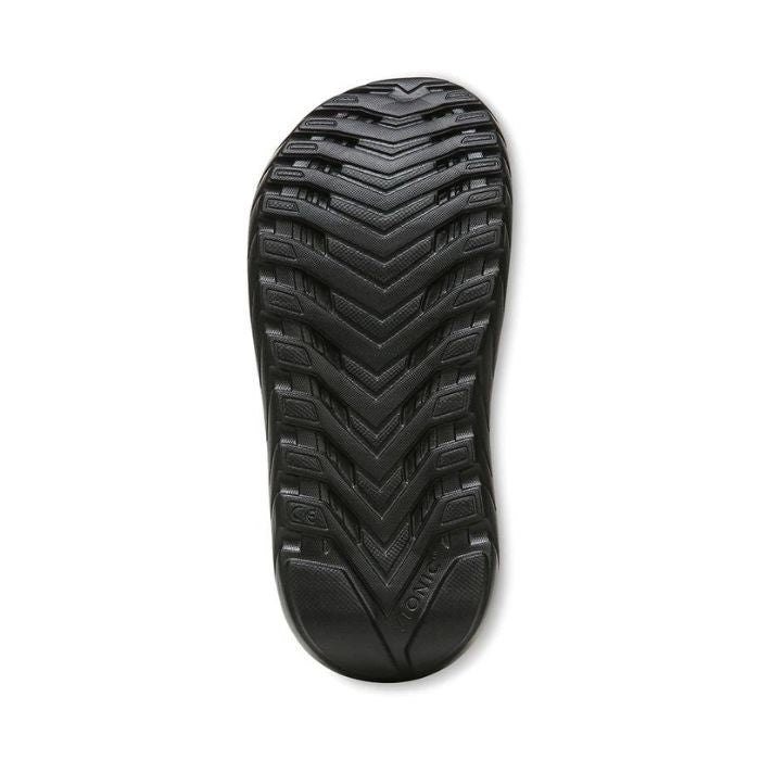 Outsole of Vionic Rejuvenate Recovery Slide Sandal with deep traction pattern for stability and slip resistance on various surfaces.