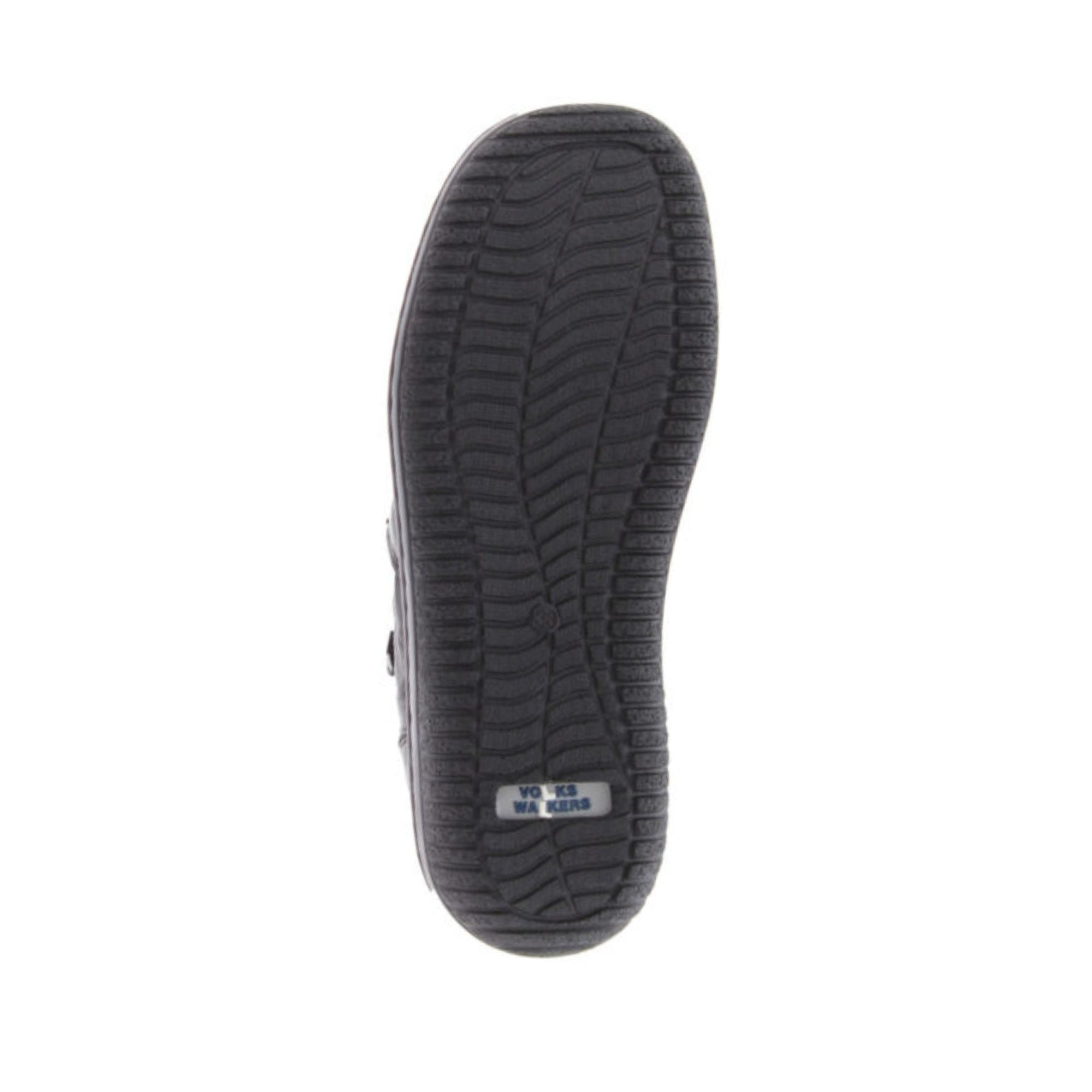 Black tread outsole on ankle boot.