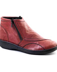 Red ankle boot with soft textured upper and side zipper.