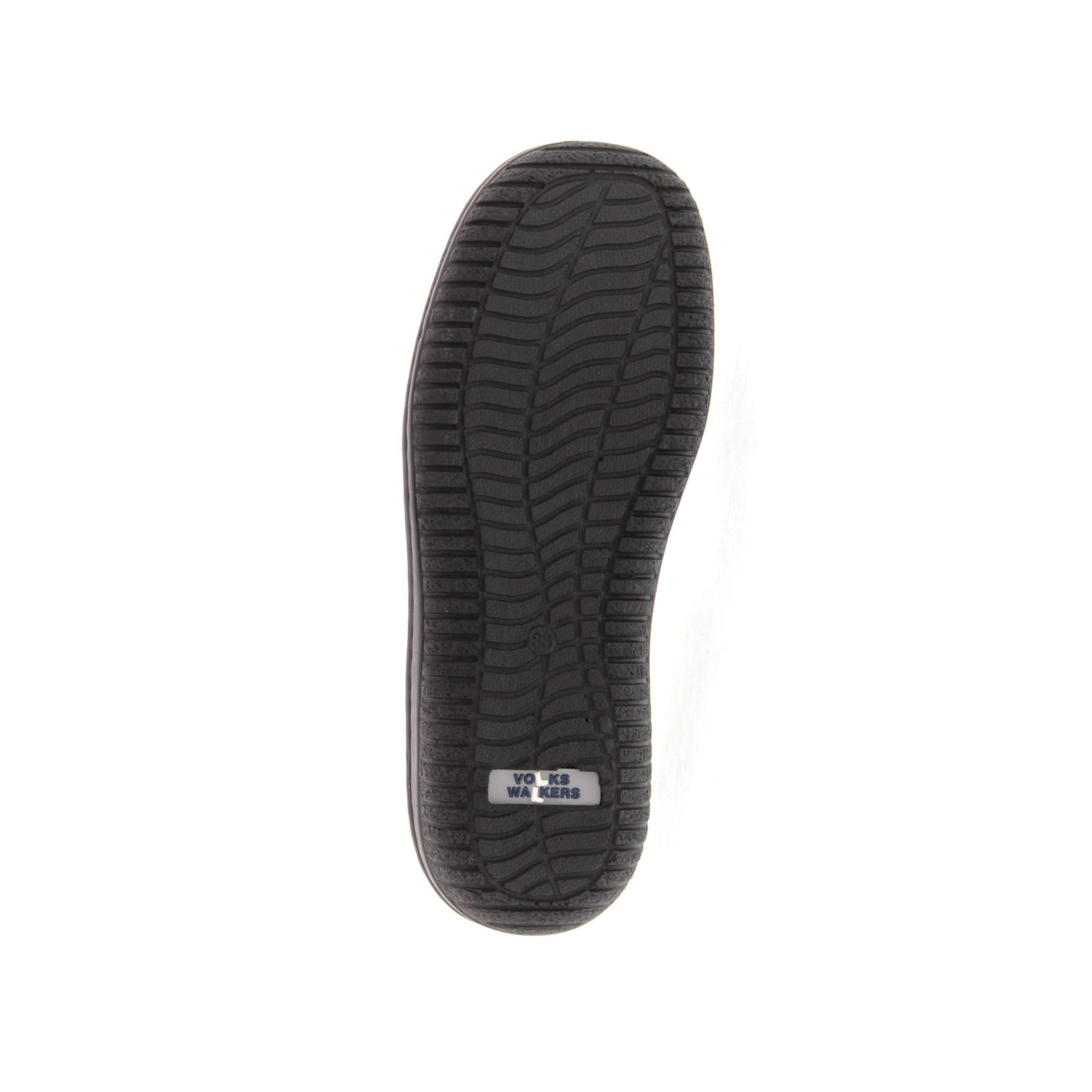 Black outsole on a slip-on shoe with Volks Walkers logo on heel.