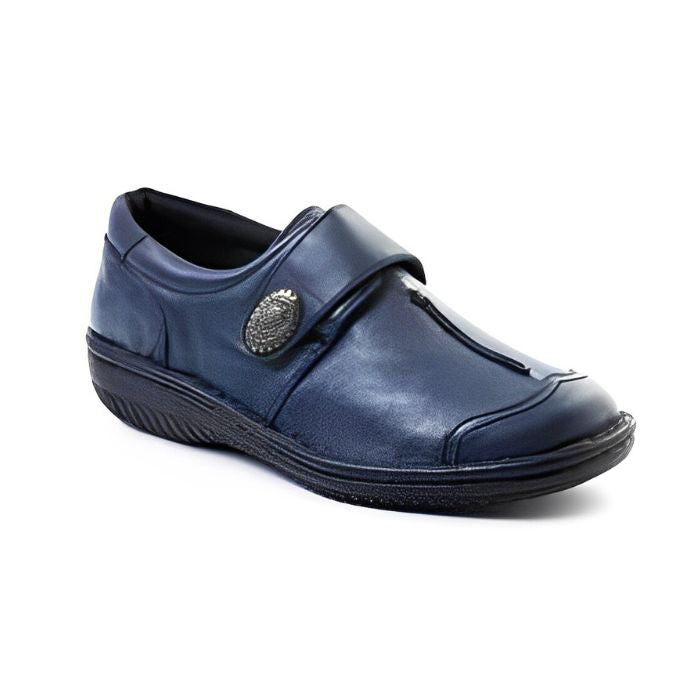 Navy slip on shoe with Velcro cross strap with metal detail and detailing stitching