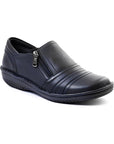 Black slip-on women's shoe with a side zipper,  textured sole, and decorative folded leather across the front.