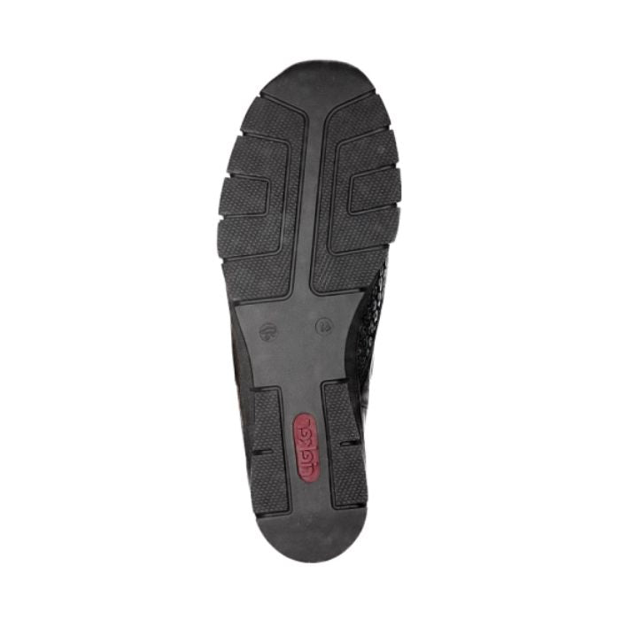 Outsole view of black Rieker 537C0 women's slip-on shoes showing shock-absorbing tread design for enhanced grip and comfort.