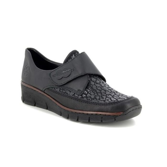 Women's Rieker 537C0 Slip-On Shoes in black with textured upper and wedge heel, ideal for lightweight fall wear and shock absorption.