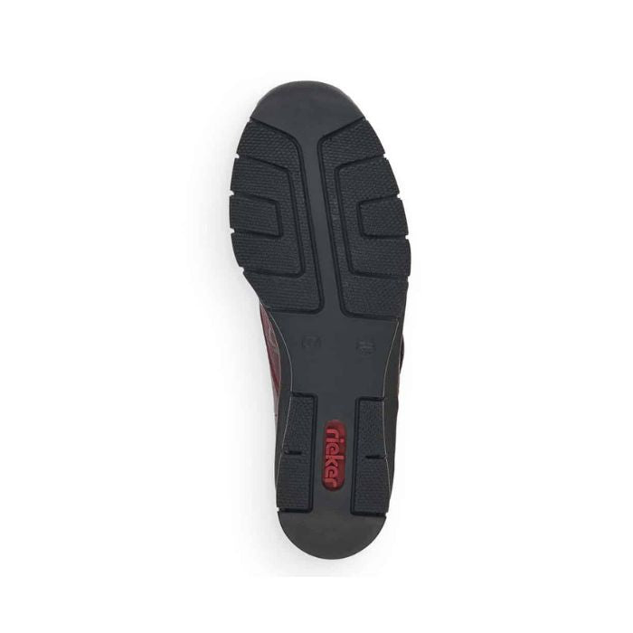Outsole of red Rieker 537C0 women's slip-on shoes with shock-absorbing tread and Rieker branding for reliable grip.