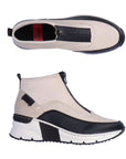 A pair of white Rieker top zipper sneaker with black accents and black and white wedge outsole.