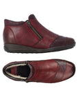 Pair of red with multi shade accents leather ankle boot with side zipper, wool lining and black outsole.
