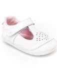 White patent leather mary jane with floral cutout detail