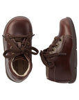 Top and side view of Brown dress shoes for youth with brown laces and detailed stitching
