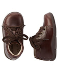 Top and side view of brown Kids Stride Rite Elliot Bootie showing soft leather upper and supportive structure for toddler foot development.