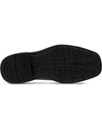 Black rubber outsole of dress shoe with Ecco logo in the center.