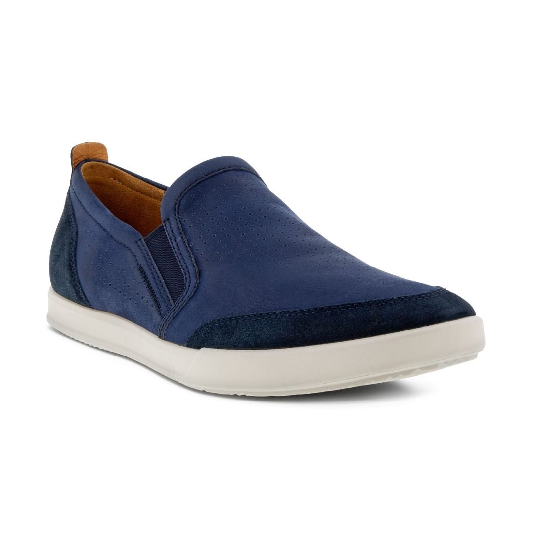 Navy leather slip on shoe with elastic goring and white outsole.