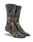 Grey socks with patterned with ostrichs burying heads in ground and 'NOPE' text on yellow signs.
