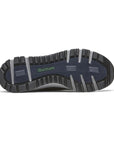 Outsole of brown Dunham Glastonbury Ubal II Sneaker featuring deep grooves for superior grip and waterproof outdoor wear.