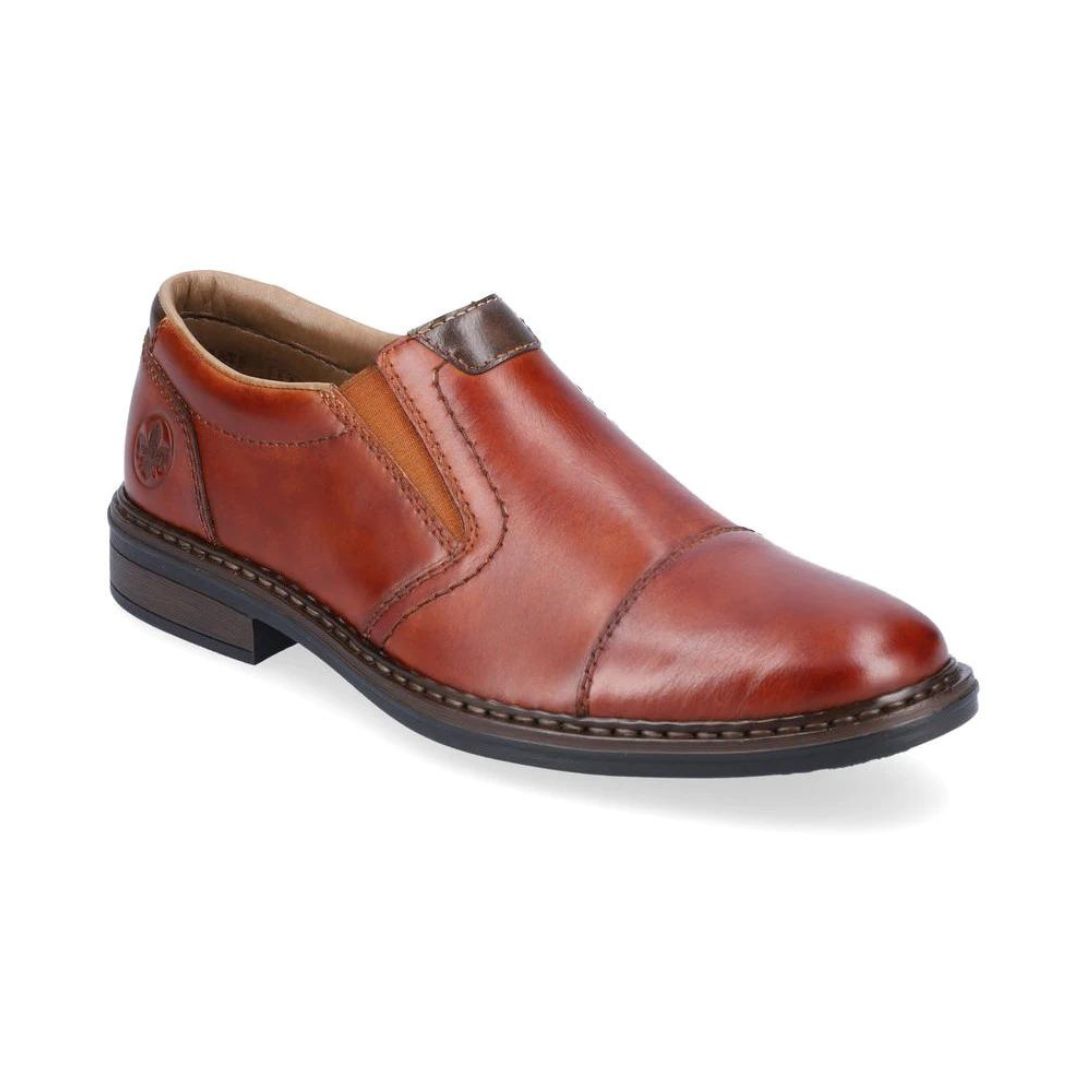 Brown leather slip-on dress shoe. Rieker logo on heel.