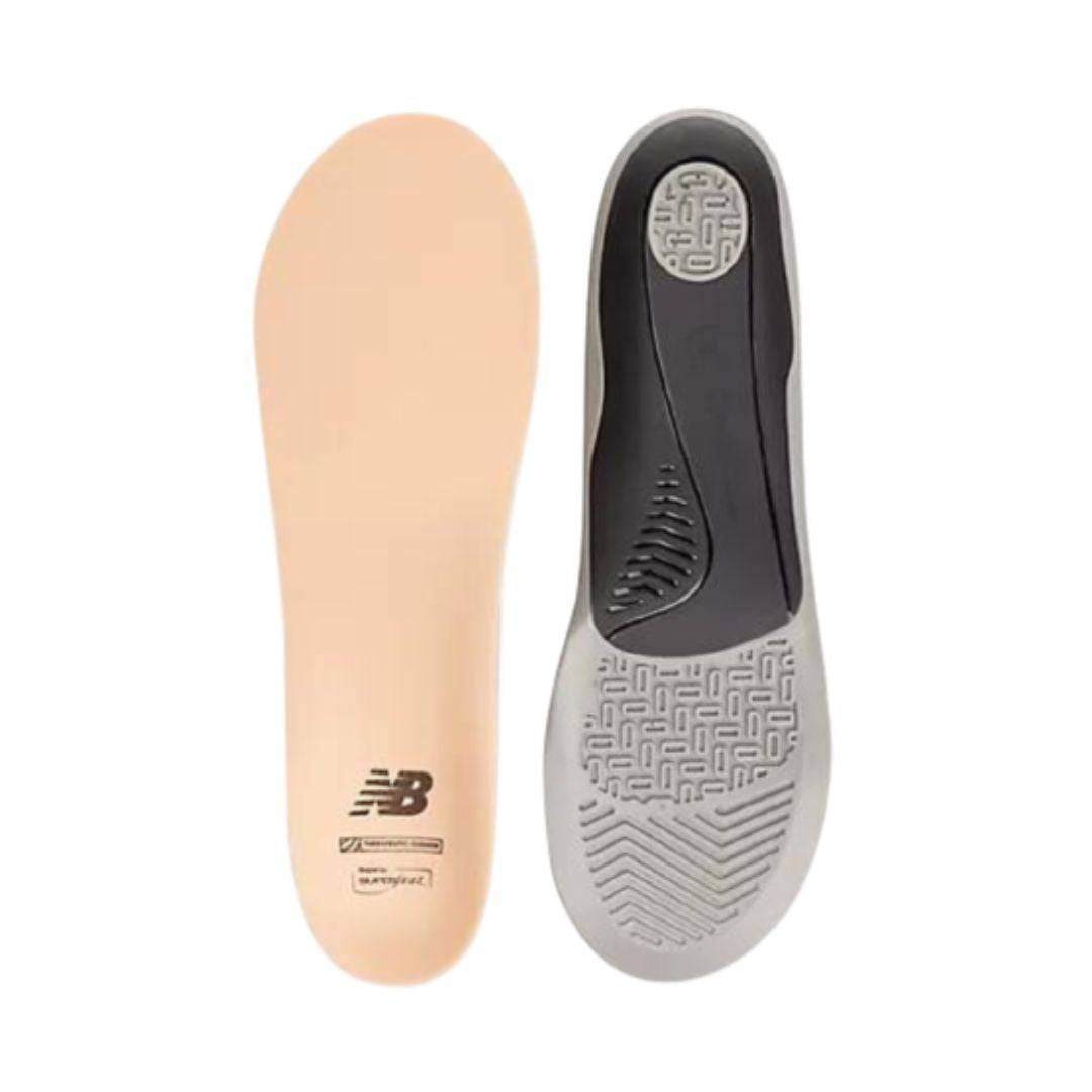 Top view of beige Superfeet insole beside bottom view of black and grey Superfeet insole.