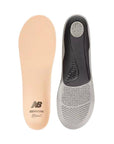 Top view of beige Superfeet insole beside bottom view of black and grey Superfeet insole.
