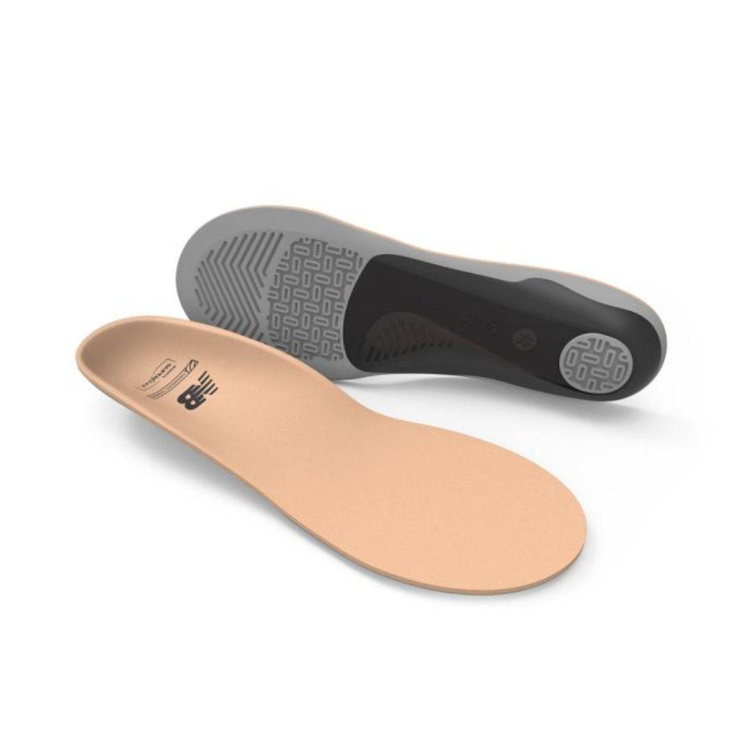 Unisex New Balance insoles show one beigefootbed flat and other on side showing thick grey and black bottom (by Superfeet)