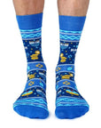 Man wearing Blue Happy Hanukkah crew socks.