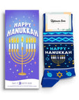 Blue Happy Hanukkah card and blue Hanukkah themed socks.