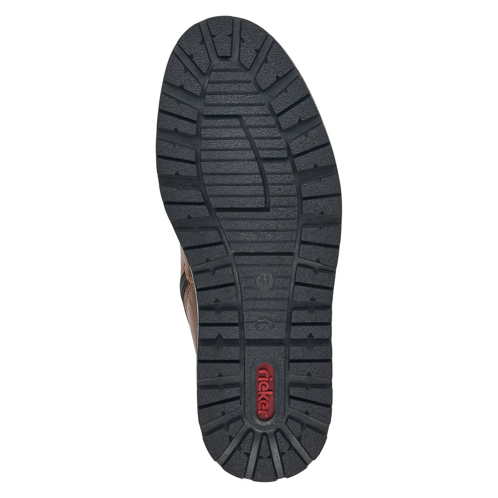 Black rubber outsole of men's boot with red Rieker logo on heel.