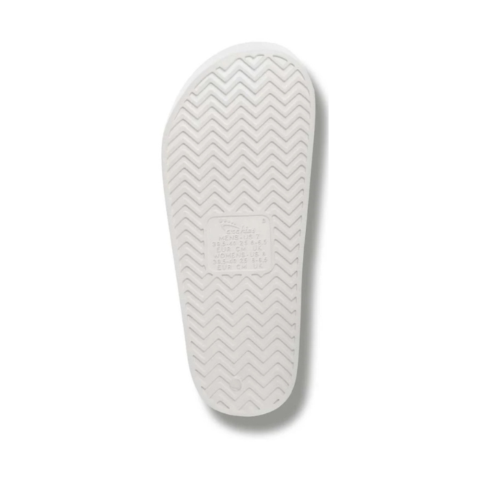 White slide sandal outsole with a zigzag pattern tread and Archies logo stamped in middle.