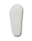 White slide sandal outsole with a zigzag pattern tread and Archies logo stamped in middle.