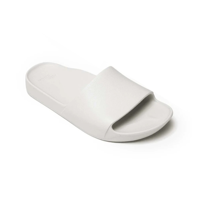 White slide sandal with Archie logo stamped in heel.
