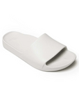 White slide sandal with Archie logo stamped in heel.