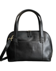 Black leather handbag with stitched lines, top zipper detachable shoulder strap and thick handles.