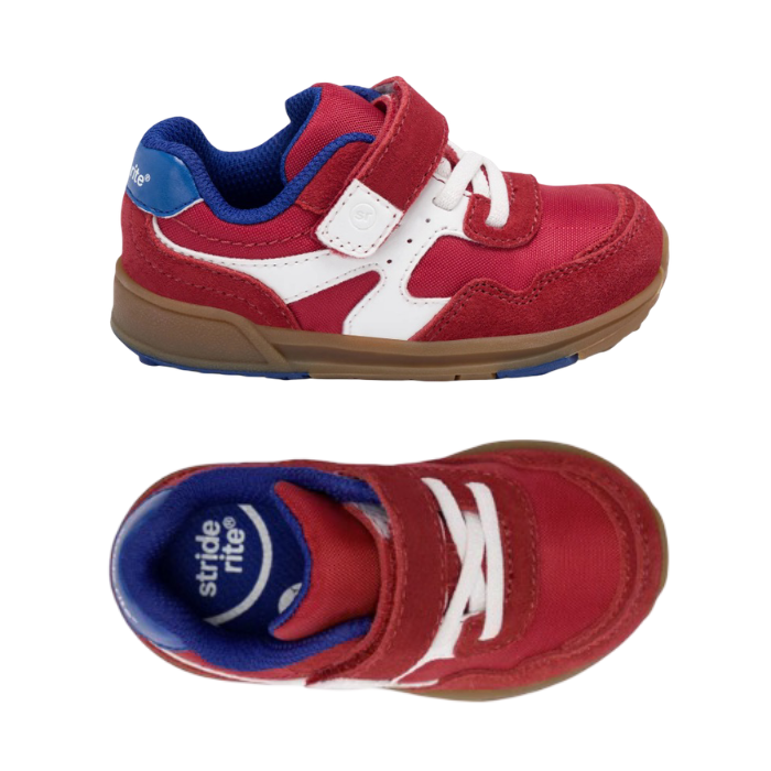 Pair of red toddler's hook-and-loop sneakers with white accents, blue lining,  padded collar, white elastic lacing, blue Stride rite logo'd footbed and a brown gum outsole.