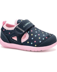 Navy children's shoe with colorful polka dots, pink lining and pink outsole..