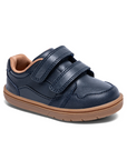 Navy blue children's shoe with two velcro straps and a brown outsole.