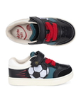 Pair of toddler's low-top black sneakers with a soccer ball graphic that lights up, teal accent panels, red towel elastic laces, a hook-and-loop strap closure and white outsole.