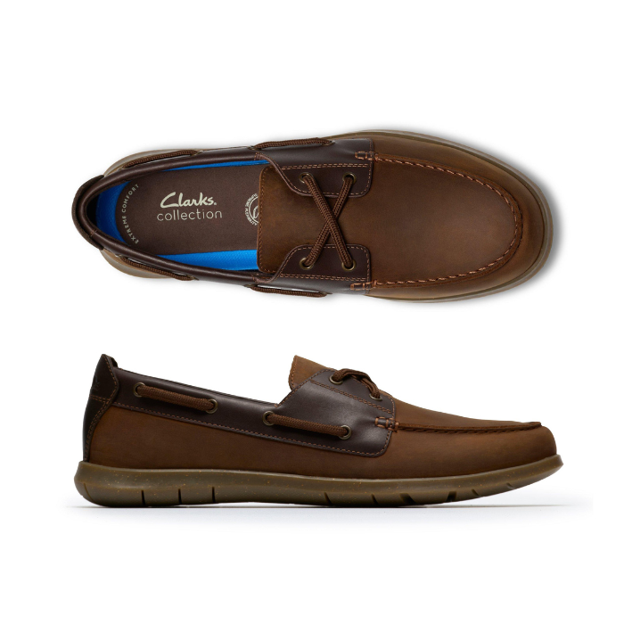 Pair of Brown boat shoe with dark accents, brown laces, "Clarks Collection" on footbed and brown outsole.