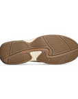 Brown outsole with wave tread designs.