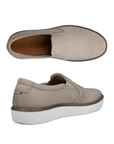 Pair of Beige slip-on shoe with light perforations, orange Ecco logo'd footbed and a white outsole.