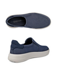 Pair of Navy slip-on shoes with accent stitching, blue Ecco logo'd footbed and a white outsole.