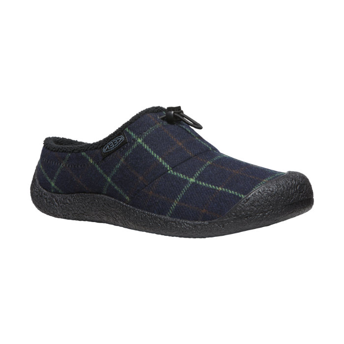 Howser III Clog in Navy. A slip-on shoe with a blue plaid textile upper, featuring an elastic bungee closure around the heel. Outsole is black. 