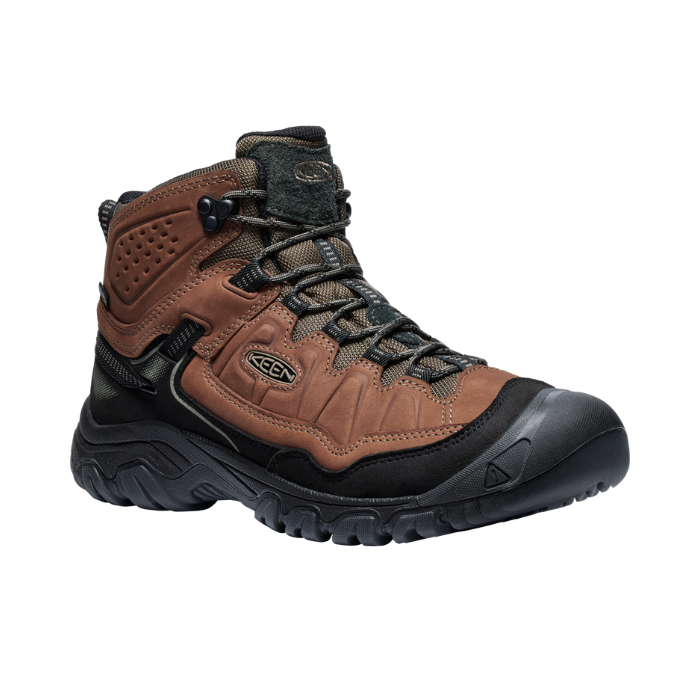 Mid-height hiker boot with brown and black nubuck upper. Laces are brown, outsole is black. 