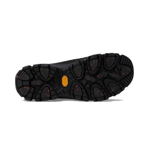 Black rubber Outsole with Vibram traction plugs and yellow logo in center.