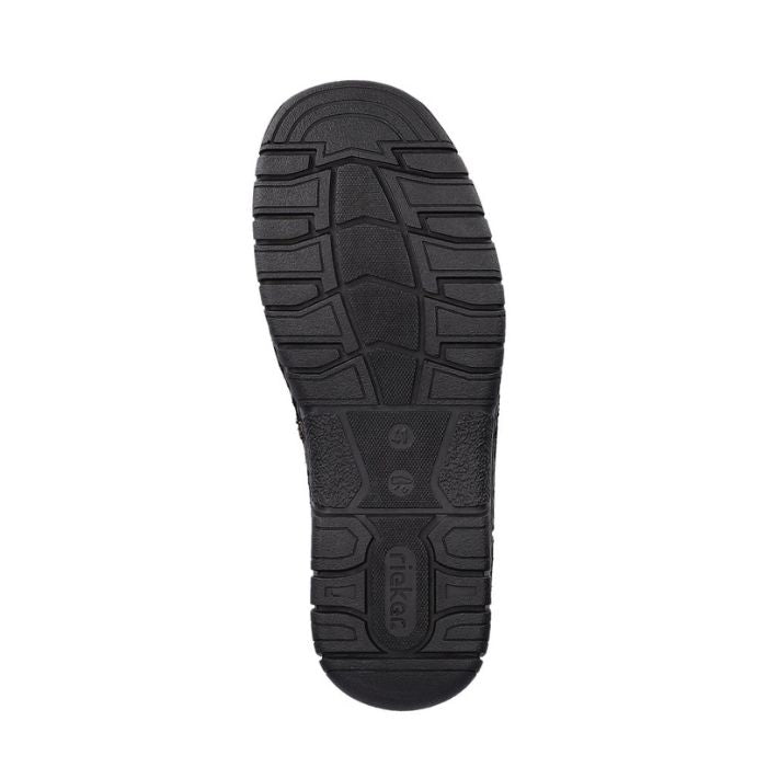 Black rubber outsole of boot with Rieker logo on heel.