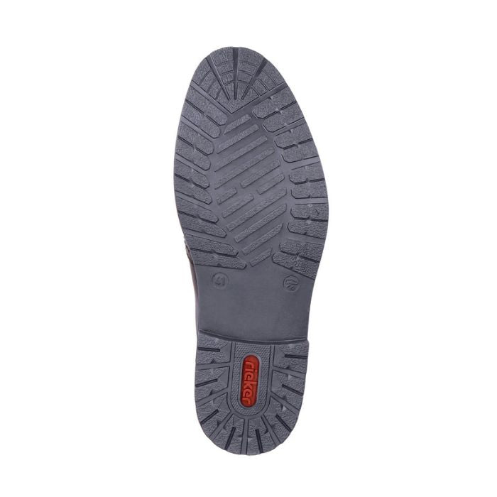 Navy outsole of men's dress shoe with red Rieker logo on center of heel.