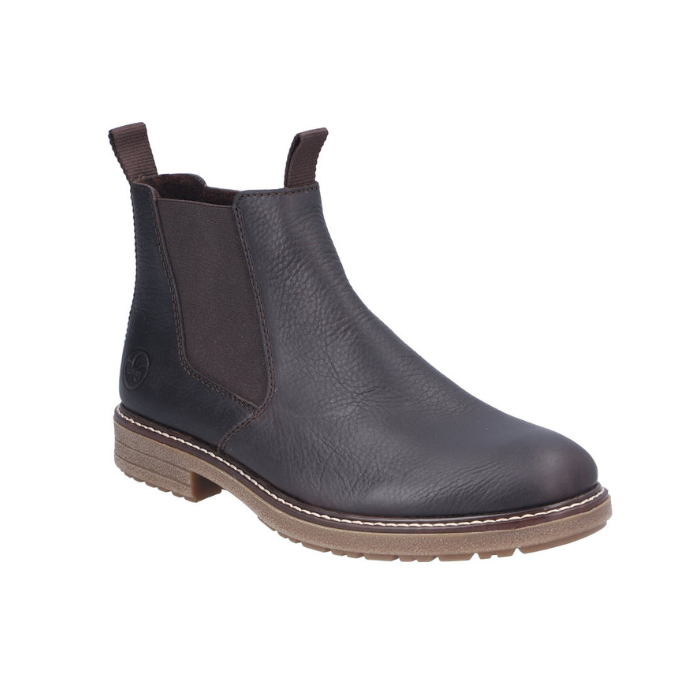 Black leather chelsea boot with elastic side panels, pull tabs and tan outsole.