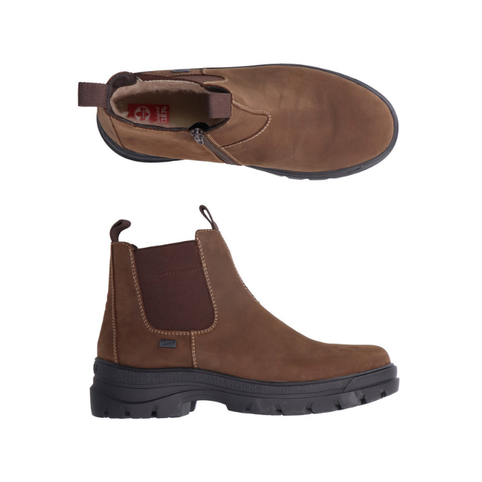 Pair of Brown Chelsea style ankle boot with black rugged outsole, elastic side panels and wool lined footbed with Rieker logo.